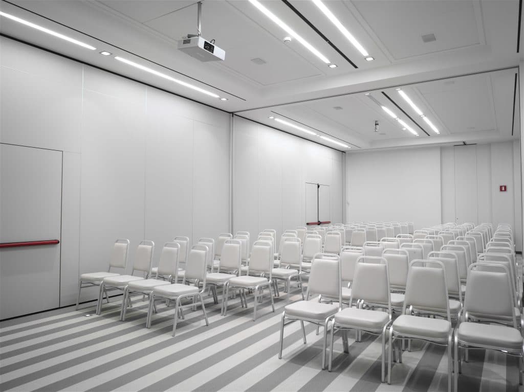 Operable partition wall system dividing a modern conference room